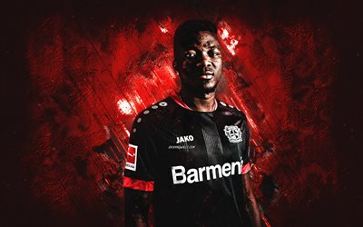 Edmond Tapsoba, Bayer 04 Leverkusen, Burkina football player, defender, portrait, red stone background, Bundesliga, Germany, football, Bayer Leverkusen
